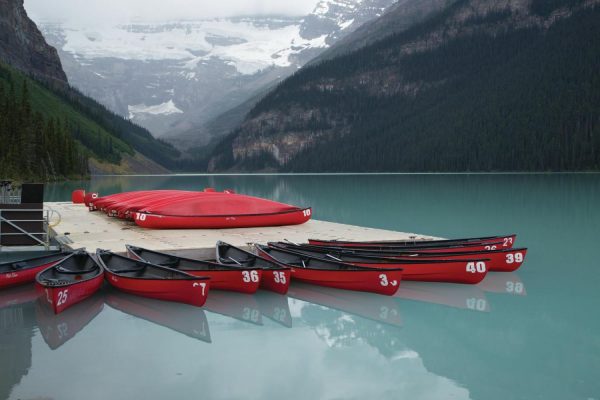 Landscapes & Scenic | Canoes On The Lake in Banff Wall Mural Landscapes & Scenic Landscapes & Scenic