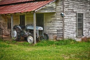 Transportation | Vintage Tractor Near An Old Farmhouse Mural Wallpaper Transportation Transportation